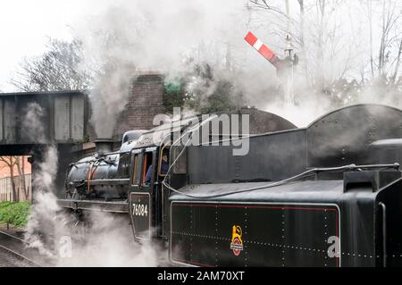 Class 4MT steam locomotive 76084 about to leave Sheringham station on the North Norfolk railway. Stock Photo