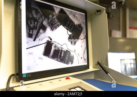 Photographer's backpack. Lenses and camera under x-ray. Checking personal belongings. Stock Photo