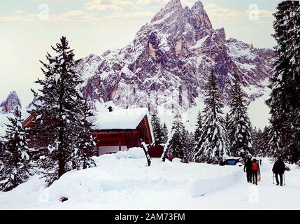 Sesto, Italy - arrival at the Rifugio Fondovalle after a beautiful walk on the snow of the Fiscalina valley with the Dolomites mountains ahead Stock Photo