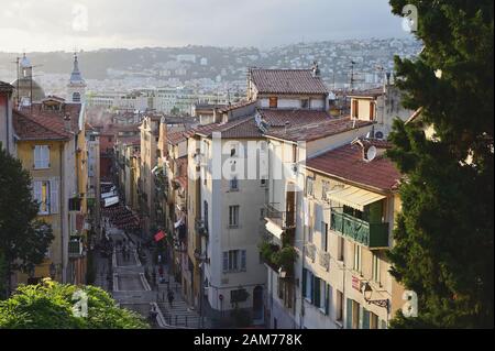 Nice, France - September 27, 2019: People on the Rosetti street in the downtown of Nice against cityscape. Nice is the largest city of French Riviera, Stock Photo