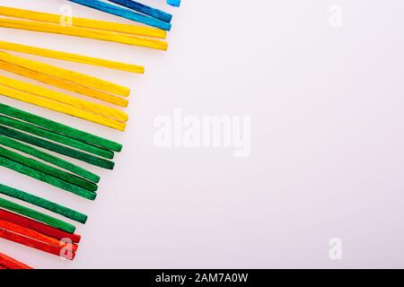 Sticks of various colors on awhite background Stock Photo