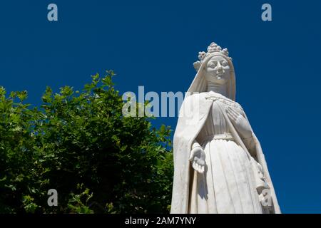 Statue of the Queen Saint Isabel outside the St Clara-a-Nova Monastery in Coimbra Portugal Stock Photo