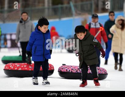 Beijing, China. 11th Jan, 2020. Kids have fun at an ice and snow carnival held in Fengtai District of Beijing, capital of China, Jan. 11, 2020. Credit: Ren Chao/Xinhua/Alamy Live News