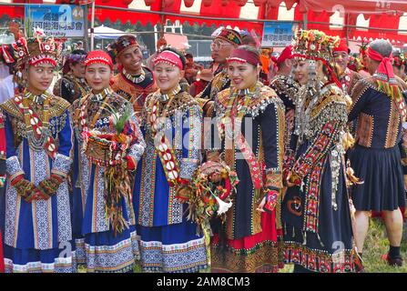 KAOHSIUNG, TAIWAN -- SEPTEMBER 28, 2019: Women of the indigenous Rukai tribe prepare for a dance during the traditional harvest festival. Stock Photo