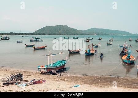 Fishing boats in the sea bay in Prachuap Khiri Khan district, Thailand Stock Photo