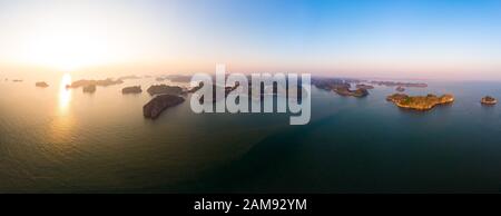 Aerial view of Ha Long Bay Cat Ba island, unique limestone rock islands and karst formation peaks in the sea, famous tourism destination in Vietnam. S Stock Photo