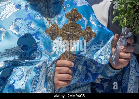 Adelaide, Australia. 12 January 2020. Greek Orthodox clergy  performs the ceremony of  the blessing of the waters on Henley pier Adelaide marking the orthodox Epiphany Day which commemorates the baptism of Jesus in the Jordan River. Credit: Amer Ghazzal/Alamy Live News Stock Photo