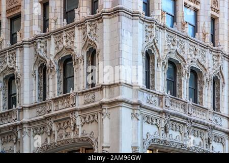 Ornate neo-gothic architectural details of window crowns of the early 20th century Woolworth Building on Broadway in Tribeca Manhattan, New York Stock Photo