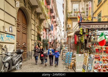 NAPLES, ITALY - JANUARY 4, 2020: tourists visiting historical center Stock Photo