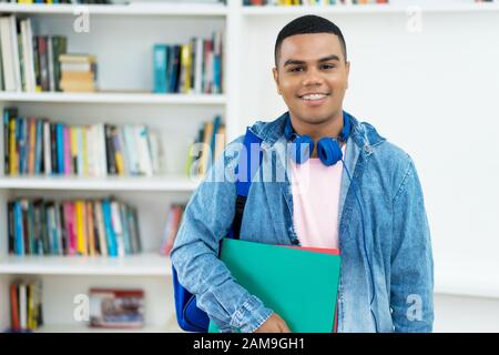 Mexican male student with braces at classroom of university Stock Photo