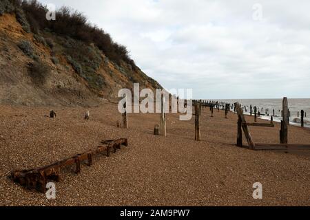 Cold War era trolly on the beach due to coastal erosion Stock Photo