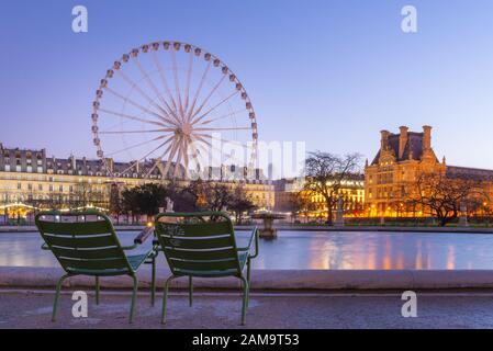 Early morning winter shot of a great wheel, Tuileries public garden, taken with long exposure, Paris, France Stock Photo