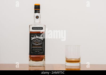 Lynchburg, Tennessee, USA - January 11 2020: Jack Daniels Sinatra Select Tennessee Whiskey in a Bottle and a Tumbler Glass on an elegant Wood Table. A Stock Photo