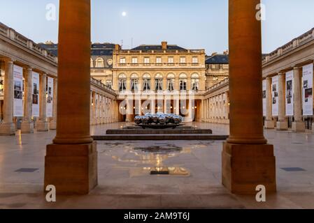 Long distance view of a modern public sculpture, taken during a winter morning at the Palais Royal public garden, Paris, France Stock Photo