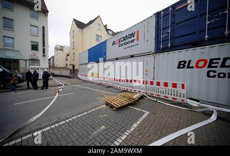 Dortmund, Germany. 12th Jan, 2020. Containers are placed in a street in the city centre as protection against a possible bomb explosion. Because of the suspicion of four aerial bombs from the Second World War thousands of people have to leave the danger zone. If the suspicions are confirmed, the bombs are to be defused today. Credit: Henning Kaiser/dpa/Alamy Live News Stock Photo