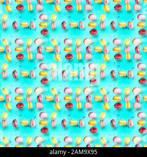 Abstract seamless pattern with flying colored macaroons, holiday concept Stock Photo