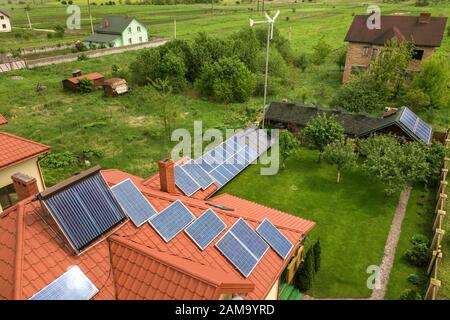 Aerial view of a new autonomous house with solar panels and water ...