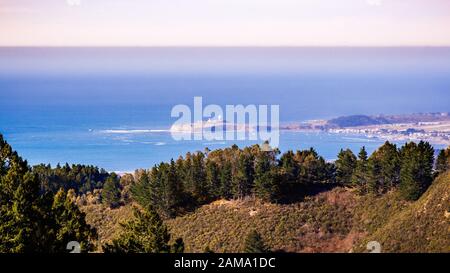 View towards the Pacific Ocean coastline and Pillar Point Harbor from Santa Cruz mountains, California Stock Photo