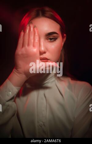 Color light on a female portrait. Neon light Stock Photo