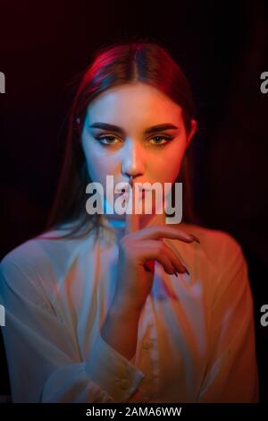 Color light on a female portrait. Neon light Stock Photo