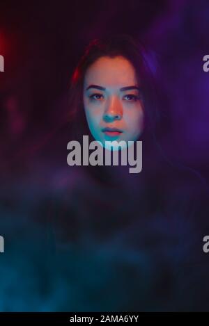 Color light on a female portrait. Neon light Stock Photo