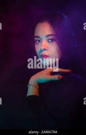 Color light on a female portrait. Neon light Stock Photo