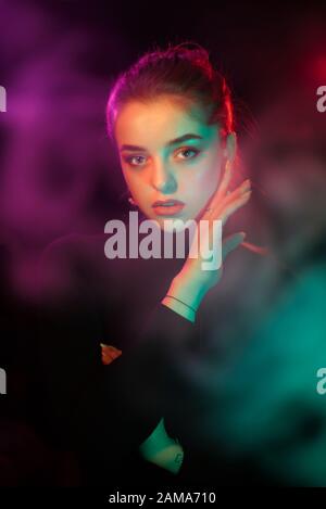 Color light on a female portrait. Neon light Stock Photo