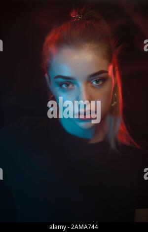 Color light on a female portrait. Neon light Stock Photo