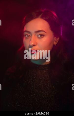 Color light on a female portrait. Neon light Stock Photo