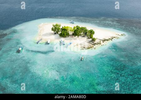 View from above, stunning aerial view of Gili Kedis with a beautiful white sand beach bathed by a turquoise and crystal clear water. Stock Photo
