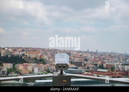 Paid binoculars on the observation deck on the background of the city. Stock Photo