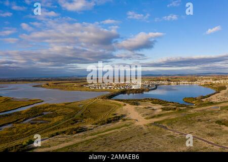 Pagham Harbour a nature reserve aerial view from the beach on a clear and beautiful day in January looking north towards Church Farm Holiday Village. Stock Photo