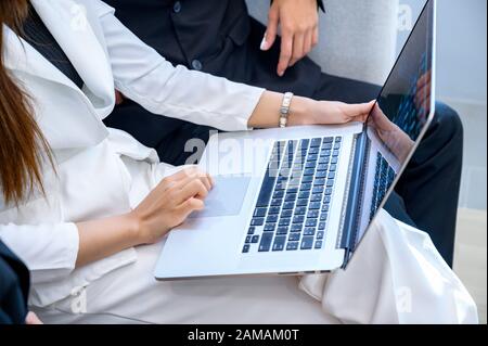 Business people are playing mobile phones and using computers Stock Photo
