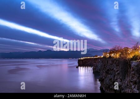 Long exposure in Antalya at sunset, clouds moving over the mountains Stock Photo