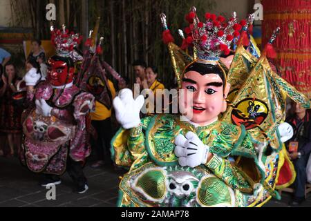 Some people dance using Taiwanese puppets in Chinese new year celebration festival in Bogor, Indonesia. Stock Photo