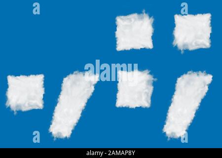 Symbols comma, dot, column, semicolon font shape element made of clouds on blue background over sky Stock Photo