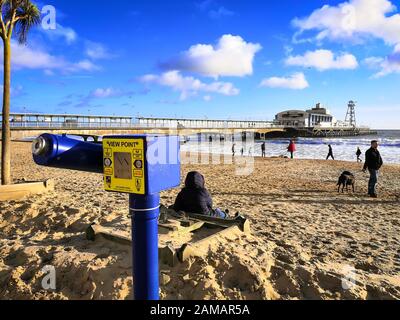 Bournemouth, UK. 12th Jan, 2020. People enjoy the winter sun with a walk on the beach in Bournemouth, Dorset. Uncommonly warm weather in the UK. Credit: Thomas Faull/Alamy Live News