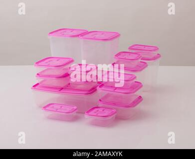set of pink plastic boxes isolated on white background Stock Photo