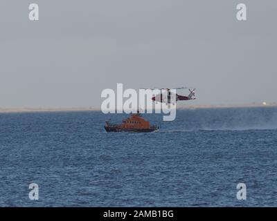 Sheerness, Kent, UK. 12th Jan, 2020. Sheerness All Weather Lifeboat 'George & Ivy Swanson' spent part of this afternoon training with the Coastguard Helicopter 163 in the Thames Estuary off Sheerness, Kent in a dramatic display involving the winchman landing onto the deck of the lifeboat at extremely close quarters. Credit: James Bell/Alamy Live News Stock Photo