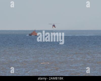 Sheerness, Kent, UK. 12th Jan, 2020. Sheerness All Weather Lifeboat 'George & Ivy Swanson' spent part of this afternoon training with the Coastguard Helicopter 163 in the Thames Estuary off Sheerness, Kent in a dramatic display involving the winchman landing onto the deck of the lifeboat at extremely close quarters. Credit: James Bell/Alamy Live News Stock Photo