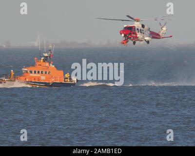 Sheerness, Kent, UK. 12th Jan, 2020. Sheerness All Weather Lifeboat 'George & Ivy Swanson' spent part of this afternoon training with the Coastguard Helicopter 163 in the Thames Estuary off Sheerness, Kent in a dramatic display involving the winchman landing onto the deck of the lifeboat at extremely close quarters. Credit: James Bell/Alamy Live News Stock Photo