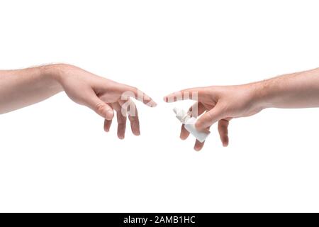 Two male hands passing one another white small plastic phial with nasal spray on white background Stock Photo