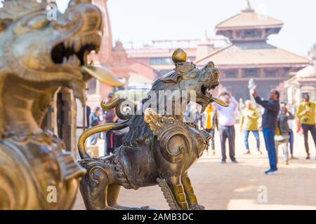 Bhaktapur Durbar Square, Kathmandu valley, Nepal. Decorative statues of mythical beasts on temple Stock Photo