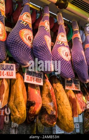 Spanish hams ( Jamon Iberico ) hanging in a charcuterie i Madrid, Spain Stock Photo