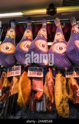 Spanish hams ( Jamon Iberico ) hanging in a charcuterie i Madrid, Spain Stock Photo