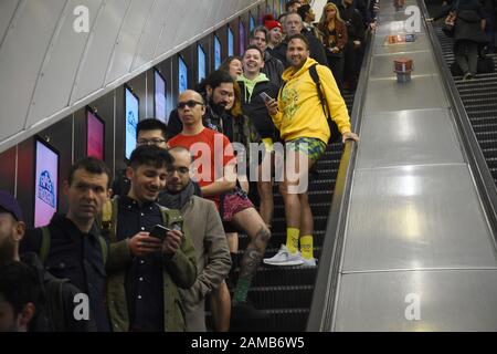 People as they take part in the 11th annual No Trousers Tube Ride in London. Stock Photo