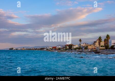 Greece. Summer evening in the small coastal town of Kyato. Windy surf Stock Photo