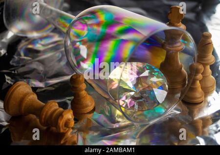 Abstract 7, an image of the refraction of colours through glass and a crystal with chess pieces Stock Photo