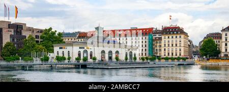 Panoramic view of the Geneva city centre with Pont de la Machine, Quai des Bergues and the multifunctional building Cite du Temps. Switzerland. Stock Photo