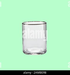 Empty wing glass on green background single with clipping path Stock Photo